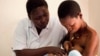 Nurse Koletha teaches Mwajuma how to breastfeed her one-day-old baby boy at the Lindi Regional Hospital, Tanzania. (Credit: Caroline Trutmann / Save the Children )