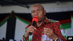 FILE - Opposition candidate Agathon Rwasa speaks at the congress of the opposition Congres National pour la Liberte (National Freedom Council) party, in Bujumbura, Burundi, Feb. 16, 2020. 