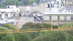 Barefoot Rope Walker Scales the Heights From the Eiffel Tower