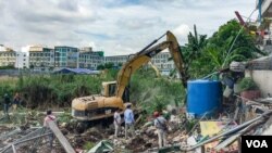 In this photo taken on May 27, 2019, residential homes belong to Boeng Kok people were bulldozed by Shukaku company, in Phnom Penh, Cambodia. 