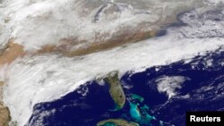 Clouds can be seen associated with a major winter storm that is bringing wintry precipitation and chilly temperatures to the U.S. South, Feb. 11, 2014.