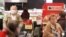 Senior citizens are seen shopping in a Delhaize supermarket as it opens an hour earlier only for people above 65 years old in an attempt to protect the most vulnerable from coronavirus risks, in Brussels, Belgium, March 18, 2020.