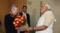 Chief Minister of the western Indian state of Gujarat and Bharatiya Janata Party (BJP) prime ministerial candidate Narendra Modi (R) presents a bouquet of flowers to US Ambassador to India Nancy Powell (L) as they meet in Gandhinagar in western Gujarat st