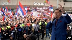 FILE - Milorad Dodik, president of the Bosnian Serb region of Republic of Srpska, sings song during a political protest in the Bosnian town of Banja Luka, 240 kilometers northwest of the Bosnian capital of Sarajevo, May. 14, 2016. 