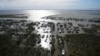 Homes are flooded in the aftermath of Hurricane Ida, Aug. 30, 2021, in Lafitte, La. The weather died down shortly before dawn.