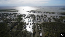 Homes are flooded in the aftermath of Hurricane Ida, Aug. 30, 2021, in Lafitte, La. The weather died down shortly before dawn.