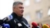 Incumbent President Zoran Milanovic talks to media after casting his ballot during a runoff vote for the Croatian presidential election at a polling station in Zagreb, Croatia, Jan. 12, 2025. 