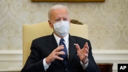 FILE - President Joe Biden meets with business leaders to discuss a coronavirus relief package in the Oval Office of the White House in Washington, Feb. 9, 2021.