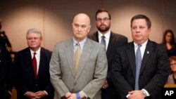 Former Balch Springs Police Officer Roy Oliver, foreground left, stands next to defense attorney Miles Brissette, right, after being sentenced to 15 years in prison for the murder of 15-year-old Jordan Edwards, Aug. 29, 2018, in Dallas. 