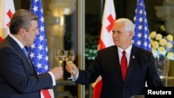 U.S. Vice President Mike Pence toasts with Georgian Prime Minister Georgy Kvirikashvili during an official dinner in Tbilisi, Georgia, July 31, 2017.