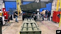 An M270 Multiple Launch Rocket System is assembled at Lockheed Martin's weapons plant in Camden, Arkansas, March 14, 2024.