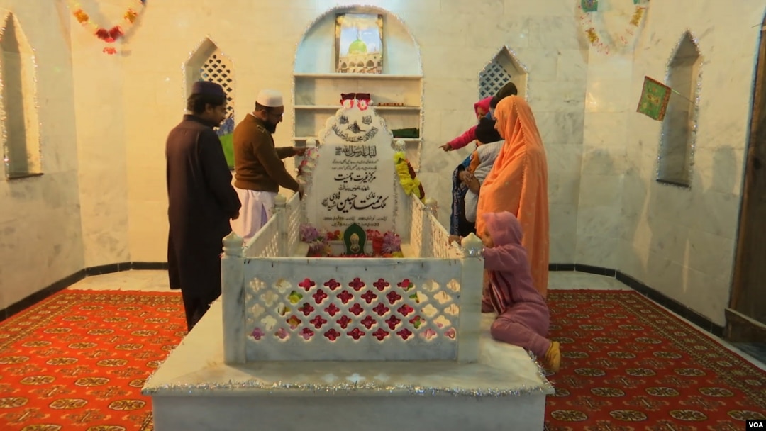 Devotees at the grave of Mumtaz Qadri on the outskirts of the capital city Islamabad. Qadri was hanged for the murder of Salmaan Taseer, a governor of Punjab province. 