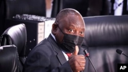 FILE: South Africa President Cyril Ramaphosa gestures during the Zondo Commission of Inquiry into State Capture, in Johannesburg. Taken 8.12.2021