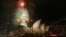 FILE - Fireworks explode over the Sydney Opera House in a display before the midnight fireworks that will usher in the new year in Australia's largest city, Dec. 31, 2015.