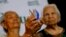 FILE - Alleged Filipino "comfort women" Narcisa Claveria, 85, left, and Hilaria Bustamante, 90, display Origami paper cranes to symbolize peace during a forum to demand justice, compensation and apology from the Japanese government.