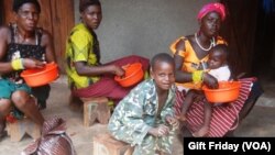 HIV sufferers in South Sudan take a meal at the Zereda center in Western Equatoria state.