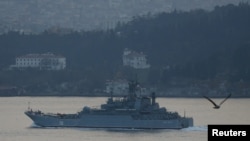 FILE - The Russian Navy's large landing ship Caesar Kunikov sets sail in the Bosphorus towards the Black Sea, in Istanbul, Turkey, Nov. 25, 2015. 