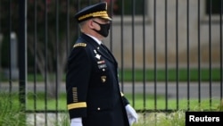 FILE - U.S. Chairman of the Joint Chiefs of Staff General Mark Milley walks outside the Pentagon, in Arlington, Virginia, Sept. 11, 2020.