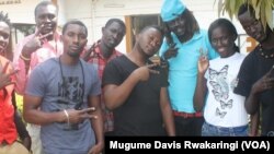 Musicians from South Sudan and Uganda, including Michael Ross (2nd from left), Meem Mabior Maen (3rd from right), and Joan Atieno (2nd from right) collaborated on a song for peace in South Sudan. 