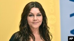 FILE - Gretchen Wilson arrives at the 50th annual CMA Awards at the Bridgestone Arena on Wednesday, in Nashville, Tenn., Nov. 2, 2016.