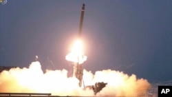 FILE - This image taken from video broadcast by North Korea's KRT shows what it says is a ballistic missile being launched from an undisclosed location in North Korea, Feb. 20, 2023. 