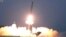 FILE - This image taken from video broadcast by North Korea's KRT shows what it says is a ballistic missile being launched from an undisclosed location in North Korea, Feb. 20, 2023. 