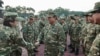 This handout picture released on Oct. 25, 2024, by the official Media Partner of the Gerindra Party shows Indonesia's President Prabowo Subianto shaking hands with a cadet during a visit to amilitary academy in Magelang, Central Java.