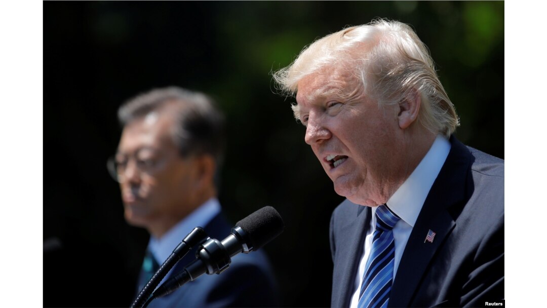 U.S. President Donald Trump (R) and South Korean President Moon Jae-in deliver a joint statement from the Rose Garden of the White House in Washington, June 30, 2017.