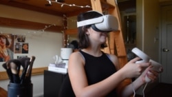 Stanford University student Gabriella Fedetto uses her VR headset as she participates in the university's Virtual People course, which takes place fully in virtual reality. (Photo Credit: ULA LUCAS/The Stanford Daily)