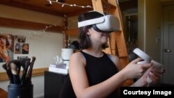 Stanford University student Gabriella Fedetto uses her VR headset as she participates in the university's Virtual People course, which takes place fully in virtual reality. (Photo Credit: ULA LUCAS/The Stanford Daily)