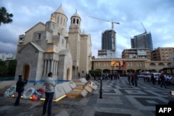 FILE - Lebanese-Armenians attend a ceremony at the Armenian Martyrs memorial at the Saint Stephano church on the eve of the 100 hundred year anniversary of the Armenians massacred by Ottoman forces a century ago, in the Armenian Orthodox Archdeocese of An