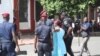 Police arrest a protester on Place de l'Independance, in Dakar, Senegal, July 25, 2017. (S. Christensen/VOA)