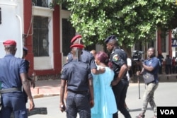 Police arrest a protester on Place de l'Independance, in Dakar, Senegal, July 25, 2017. (S. Christensen/VOA)