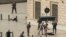 French police point a gun at a man on the ground (C) as a stabbed woman lies (L) while soldiers secure the area following an attack on October 1, 2017 at the Saint-Charles main train station in the French Mediterranean city of Marseille.