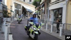 Police officers on motorcycles patrol on deserted streets ahead of the G-7 summit in Biarritz, France, Aug. 23, 2019. 
