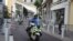 FILE - Police officers on motorcycles patrol on deserted streets in Biarritz, France, Aug. 23, 2019. 
