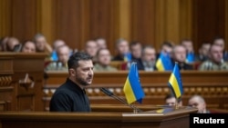 Ukrainian President Volodymyr Zelenskyy addresses lawmakers as he presents his 'victory plan' during a parliament session in Kyiv on Oct. 16, 2024.