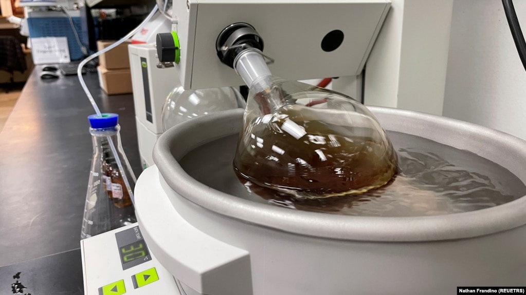 A whiskey sample made by Bespoken Spirits is placed in scientific equipment during a process designed to remove some chemicals from the liquid at the company's lab in Menlo Park, California, U.S. on December 7, 2021. (REUTERS/Nathan Frandino)