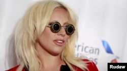 Lady Gaga poses on the red carpet before the Songwriters Hall of Fame ceremony in New York, June 18, 2015. 