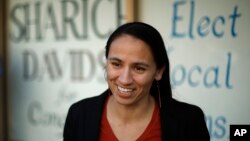 Democratic congressional candidate Sharice Davids talks to supporters at her campaign office, Oct. 22, 2018, in Overland Park, Kan. Davids is challenging Republican incumbent Kevin Yoder in Kansas' 3rd Congressional District.