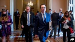 Treasury Secretary Steven Mnuchin, right, and White House chief of staff Mark Meadows, leave a meeting with Senate Majority Leader Mitch McConnell as negotiations continue on a coronavirus relief package on Capitol Hill in Washington, Aug. 4, 2020.
