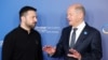 FILE - German Chancellor Olaf Scholz (R) greets Ukrainian President Volodymyr Zelensky as he arrives to attend the Ukraine Recovery Conference in Berlin on June 11, 2024.