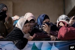 FILE - Palestinian women mourn th death of Methqal Rayan, 27, in the village Qarawat Bani Hassan, February 2, 2023. The Palestinian Health Ministry said an Israeli settler shot him in the head,..