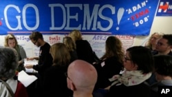 FILE - Democratic Party volunteers get instructions for canvassing neighborhoods, Nov. 4, 2016, following a get-out-the-vote rally at a campaign office in Seattle. Democrats see local mobilization efforts as key to prevailing over Republican candidates in the 2018 midterm elections.