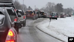 Cars are stuck in traffic as a winter storm arrives, in Newington, New Hampshire, Feb. 8, 2013.
