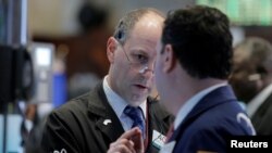 Traders work on the floor of the New York Stock Exchange in New York City, May 25, 2016.