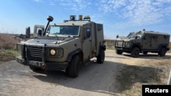 Israeli military vehicles patrol in the Israeli-occupied Golan Heights near the border with Syria on Dec. 6, 2024.