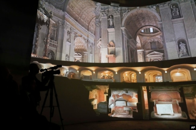 Images of St. Peter's Basilca are projected on a screen during a press exhibition 'Petros eni', which is part of the project "St. Peter's Basilica: AI-Enhanced Experience" at the Vatican, Saturday, Nov. 9, 2024. (AP Photo/Gregorio Borgia)