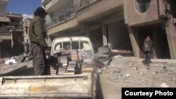 Books are rescued from a bombed and abandoned building to be taken to a secret library in the town of Daraya, Syria. (Photo courtesy of Daraya Council Media Team)