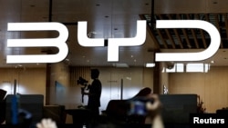 FILE - The BYD logo is displayed at the Beijing International Automotive Exhibition on April 25, 2024. BYD's new partnership with Uber announced this week is one example of how China continues to inject itself into the electric vehicle global market despite looming tariffs.